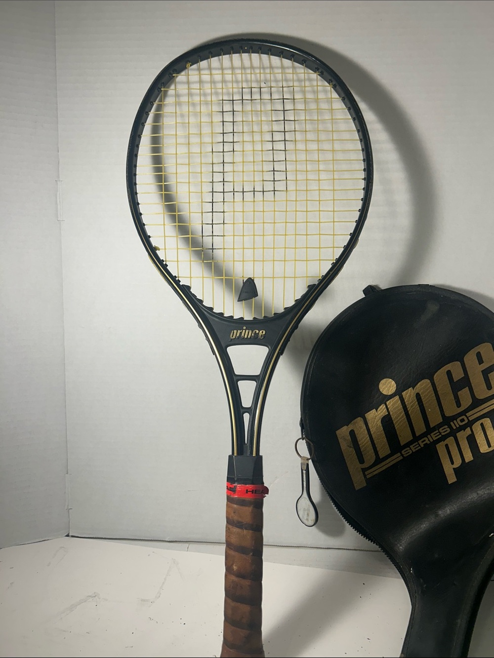 Prince Black Frame Tennis Racket with Yellow Strings Vintage 4 1/2 Grip